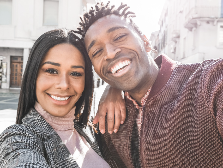 young couple taking photo | dentist manchester nh