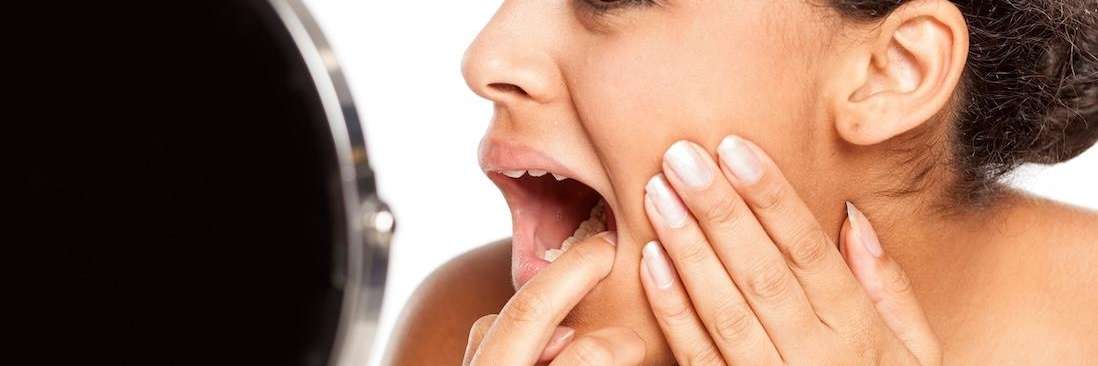 patient checking inside of mouth | dentist goffstown