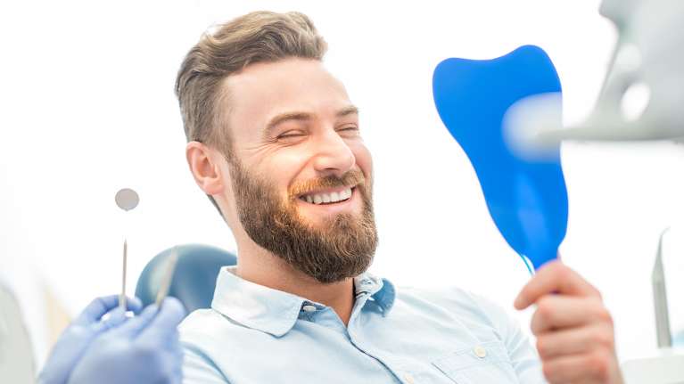 man sitting in a dental chair