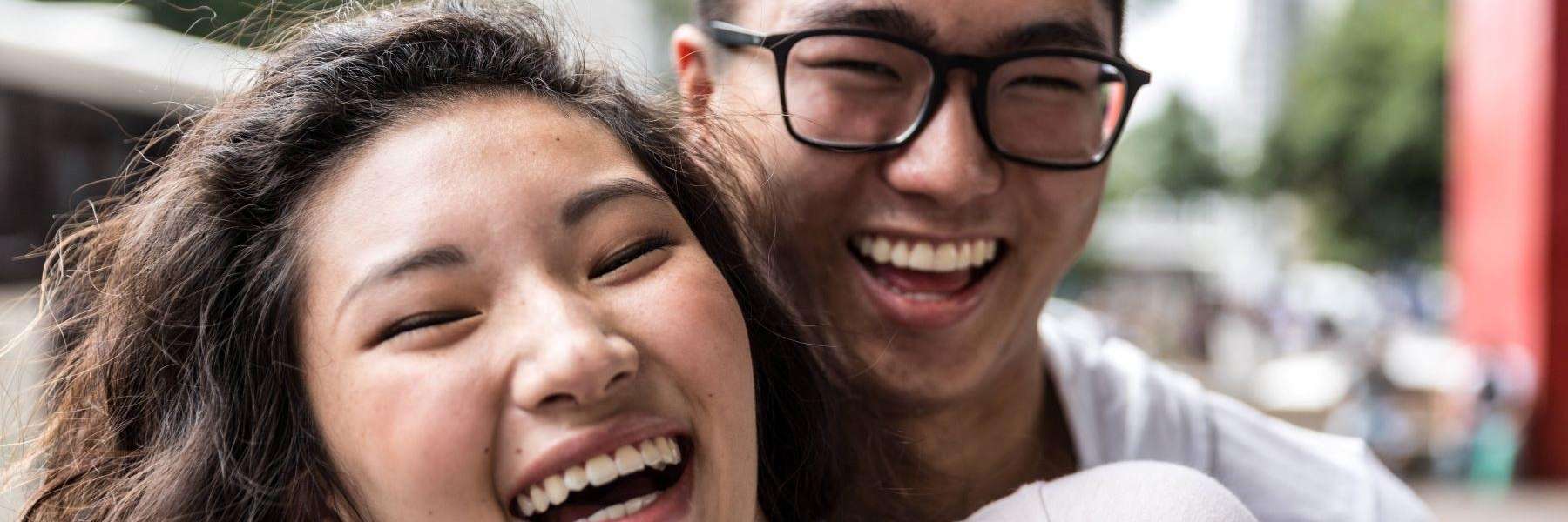 young couple laughing | dentist near me
