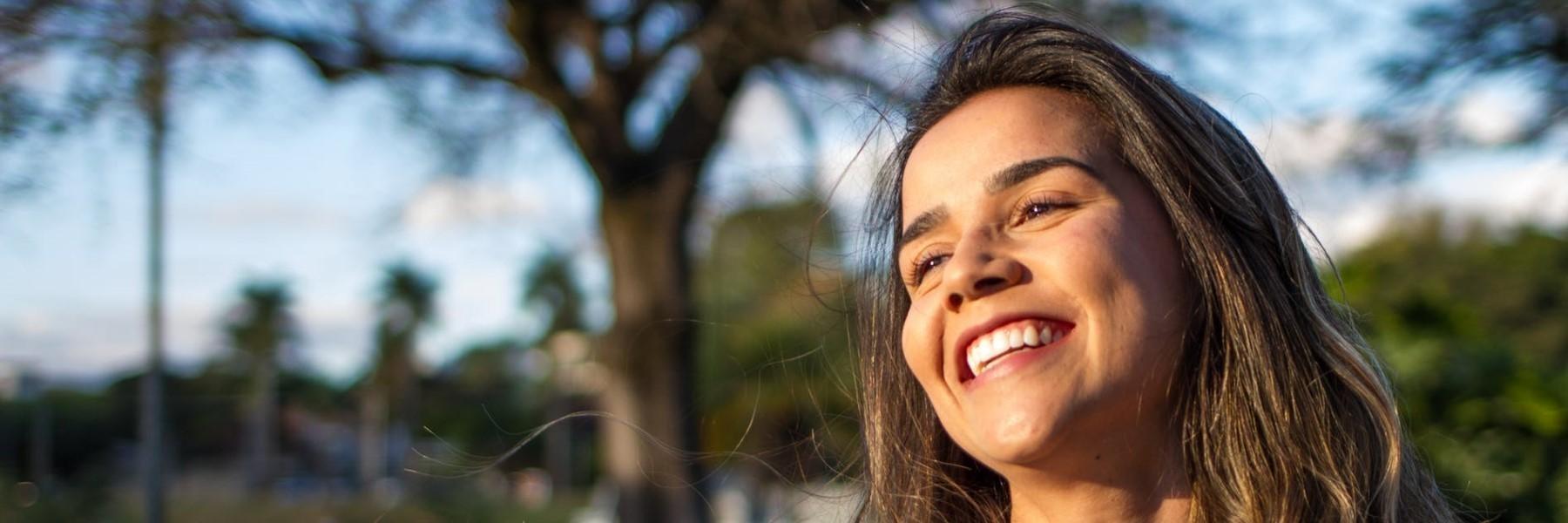 woman with black hair smiling l cosmetic dentist goffstown nh