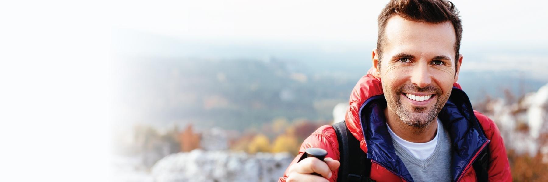man hiking smiling l teeth whitening goffstown nh