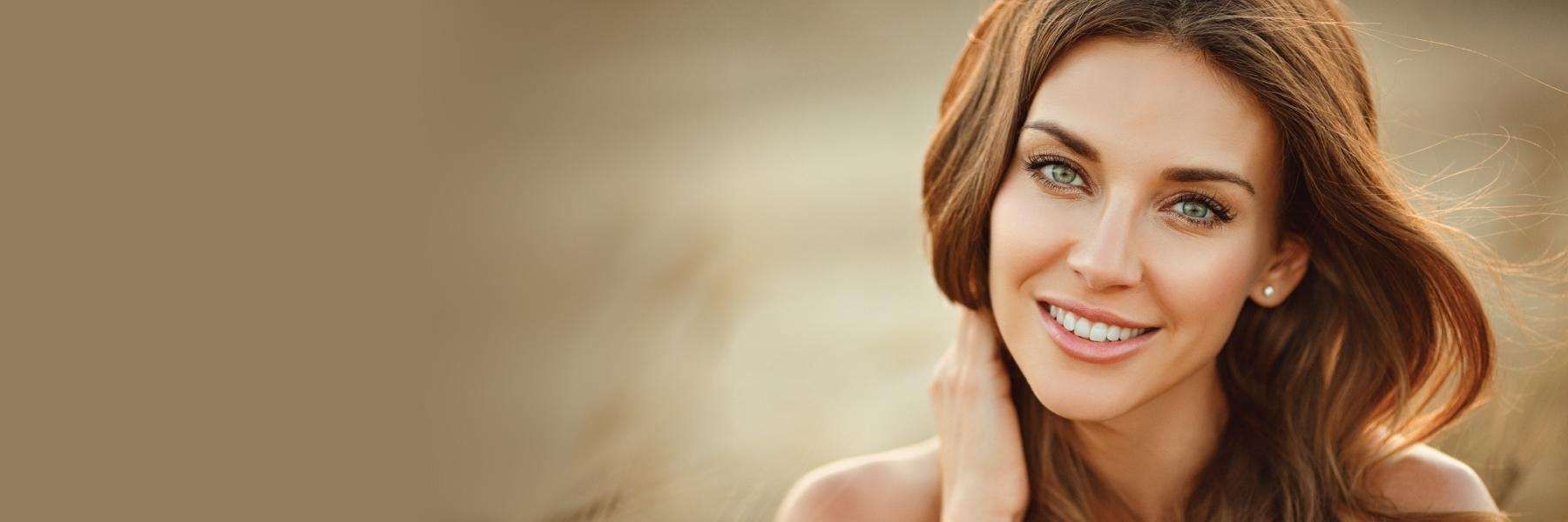 woman with brown hair smiling | veneers goffstown nh